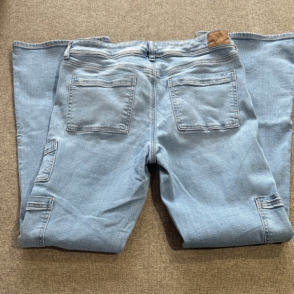 American Eagle Next Level Stretch Kick Boot Carpenter Pockets Light Wash Jeans - Picture 7 of 11